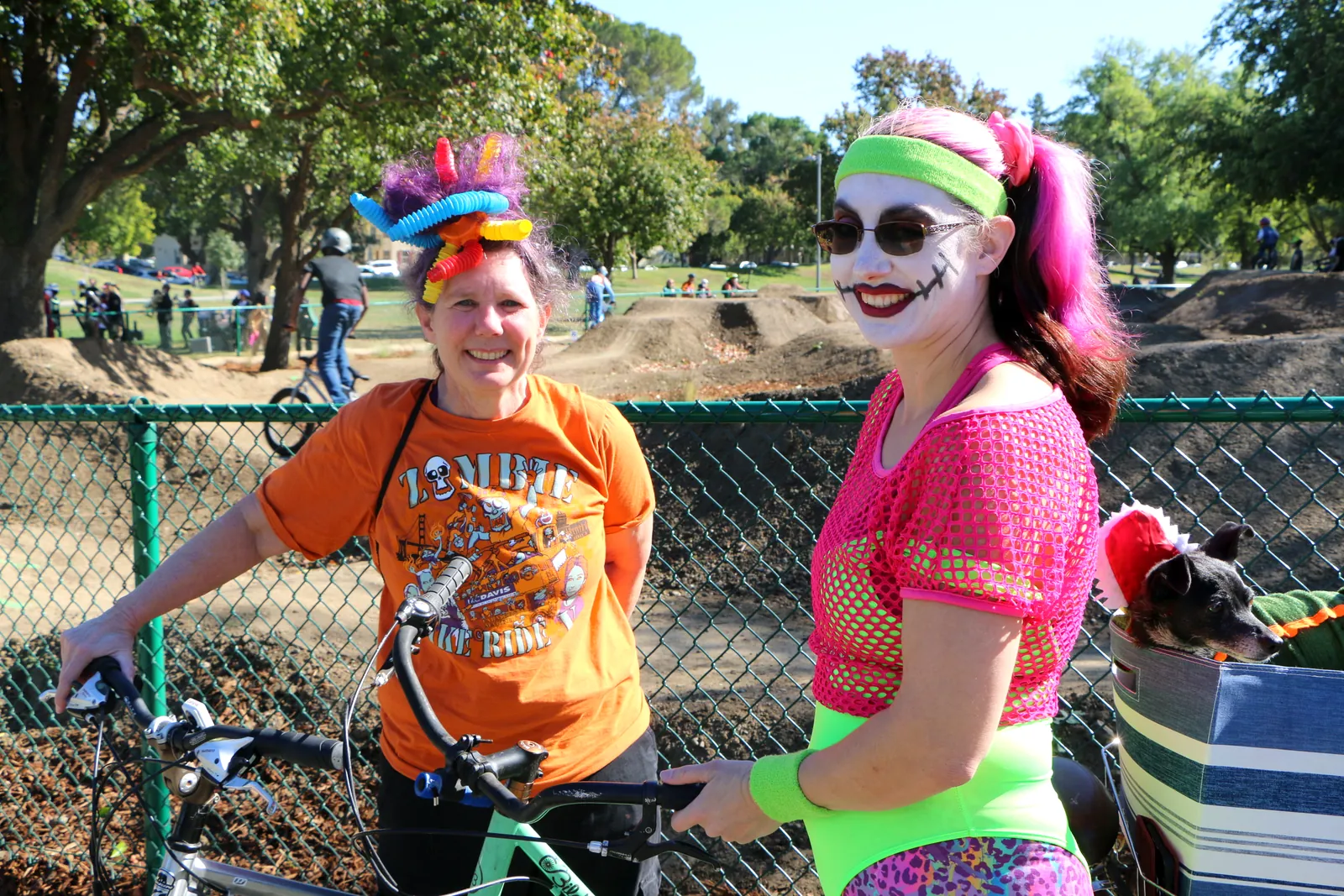 Costumed participants pose together with their bikes