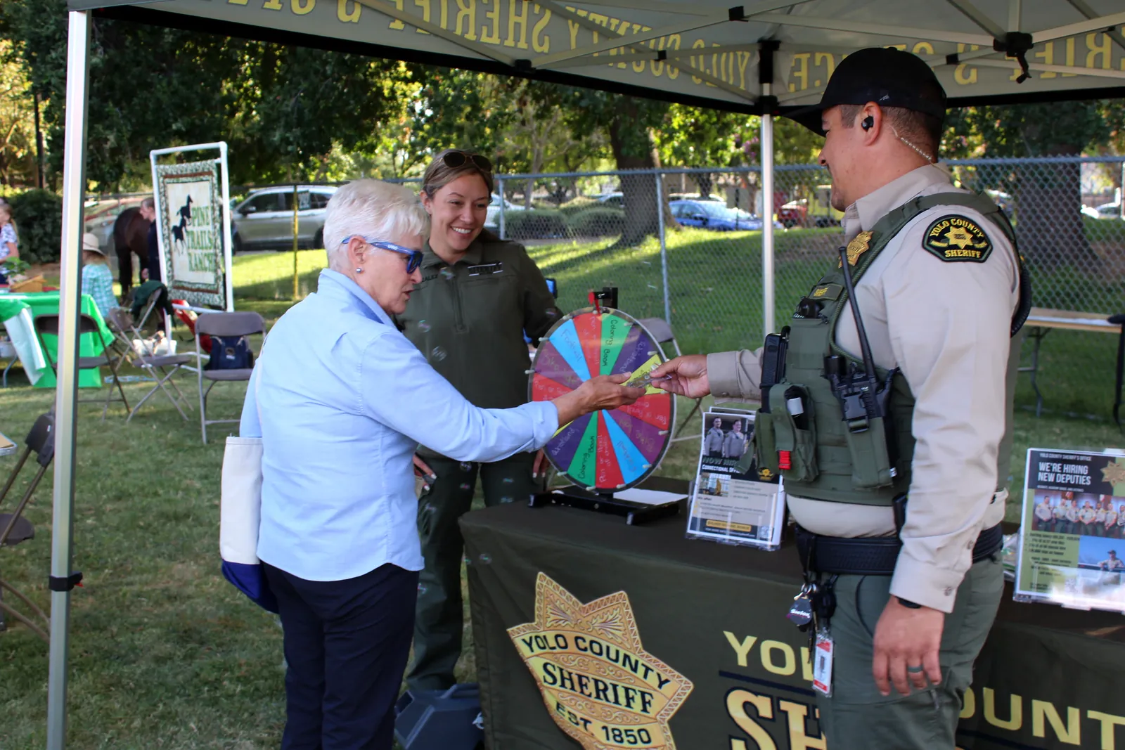 Chamber representatives gather at an event booth during Family Fun Fest